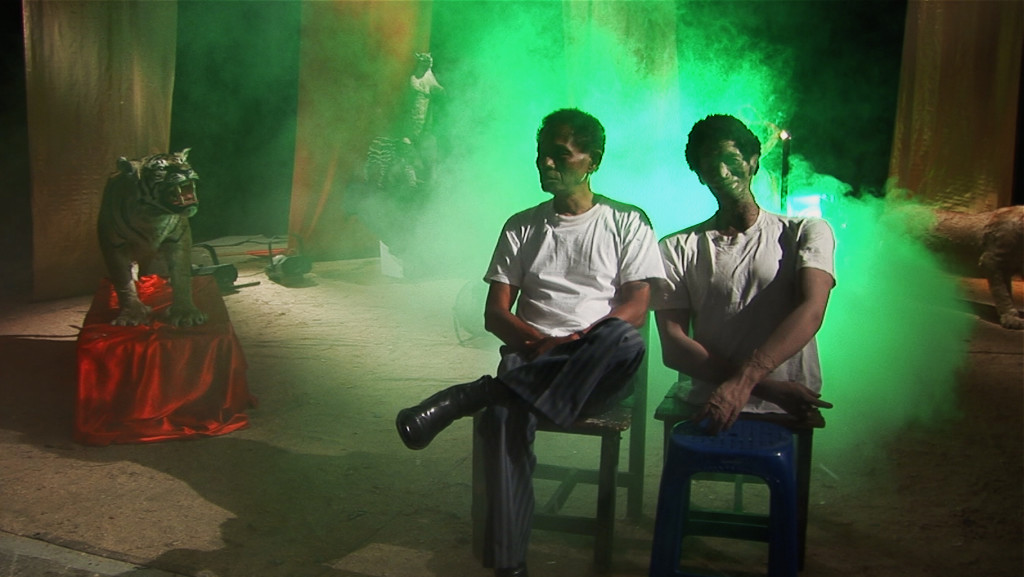 Executioner Anwar Congo (left, with a prop dummy) appears in the film -- sometimes as a victim of atrocities he participated in or oversaw.