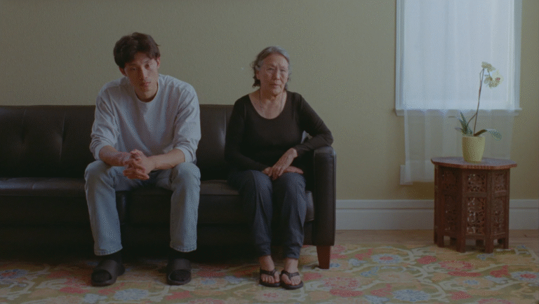Still from FIDMarseille 2025 film Next Life: Man and woman sit on a couch.