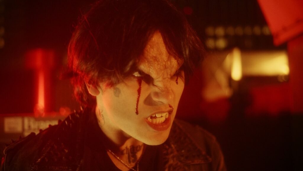 Close-up of a scary, angry person with blood tears. Horror, Halloween, special effects makeup. The Serpent's Skin.