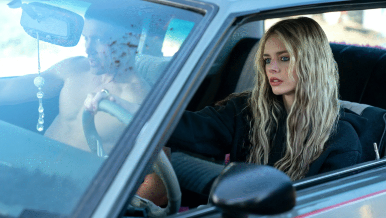 Actress Samara Weaving driving a car in Eenie Meanie review, 20th Century Studios.