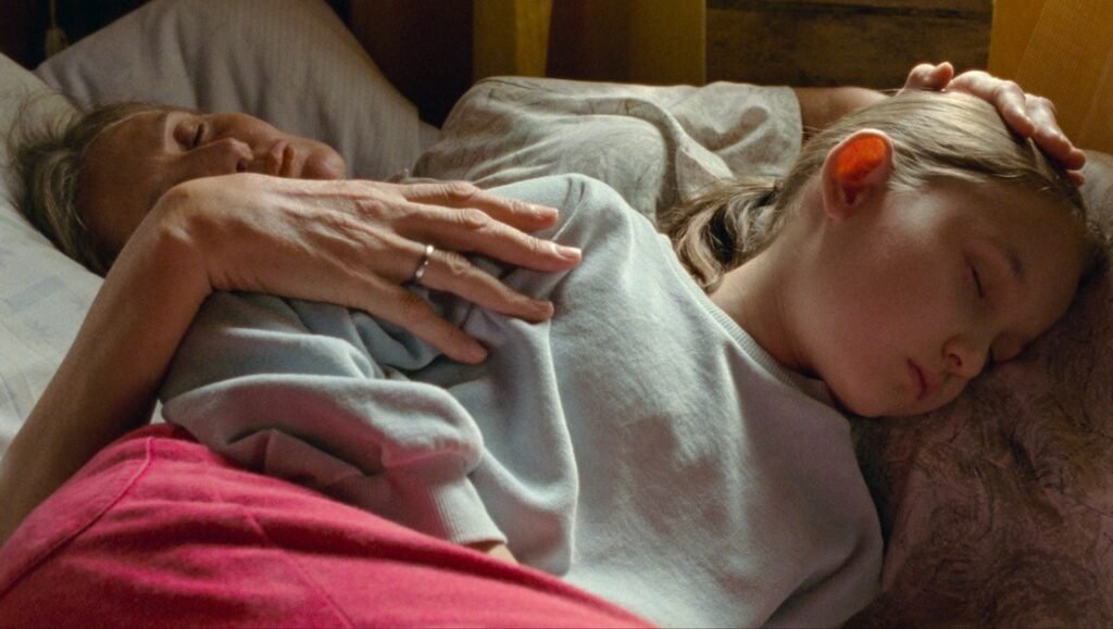 Short Summer film still: Woman and child sleeping. Venice Film Festival 2025.