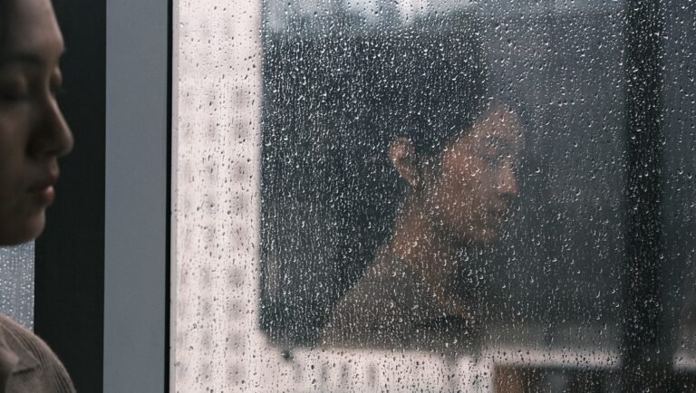 Actress Prapamonton Eiamchan in Human Resource at Venice Film Festival. Raindrops on glass, reflective mood.