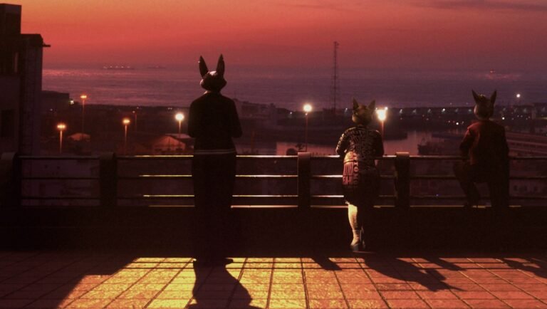 Bouchra, Girl, Dead Lover still from TIFF 2025. Three figures with animal masks overlook a cityscape at dusk.