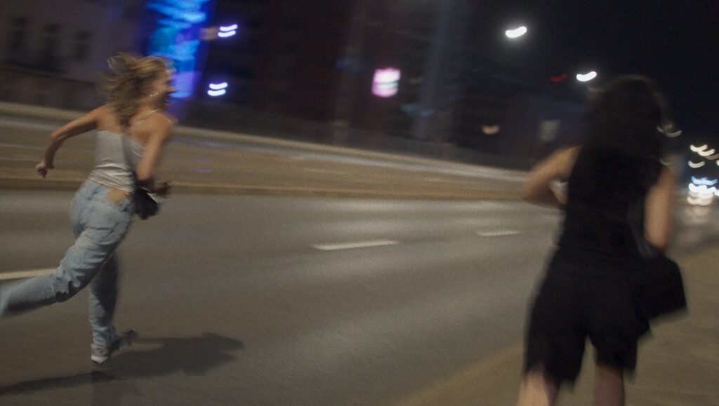 Two women running at night. 100 Sunset TIFF '25 film review.