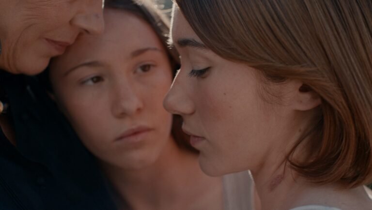 Still from Forestera (TIFF '25). Close-up of three women. A multigenerational story about family, love, and loss.