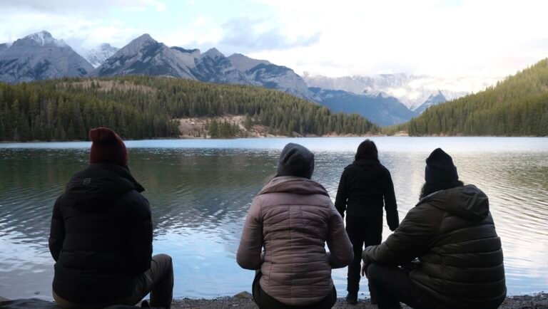 Four people at a lake overlooking mountains. Meadowlarks TIFF '25 film review.