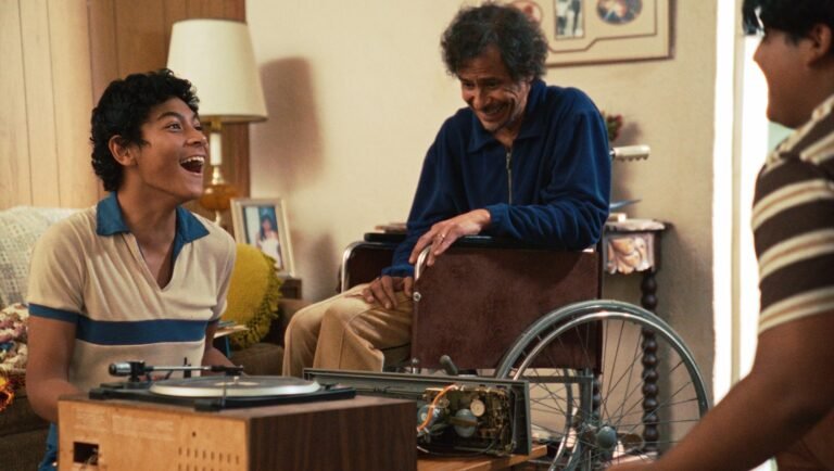 TIFF 2025: Still from Mile End Kicks, featuring a man in a wheelchair, a record player, and two younger men.