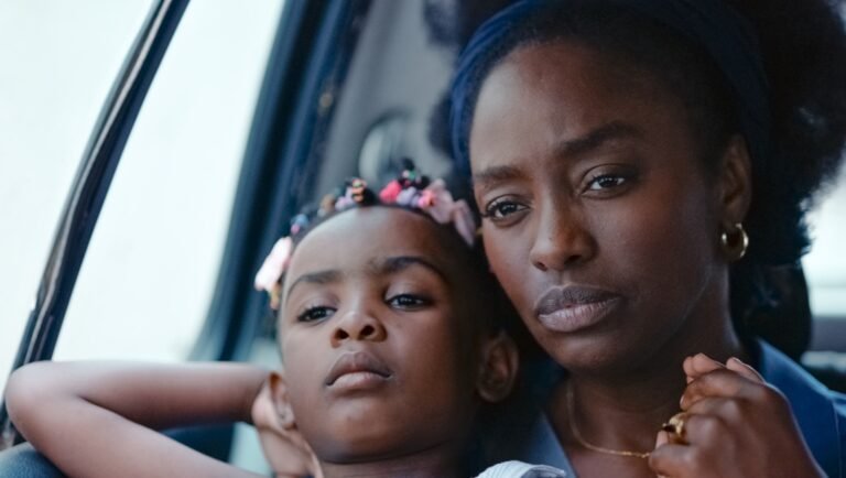 Close-up of a Black mother and daughter in a car. Family travel.