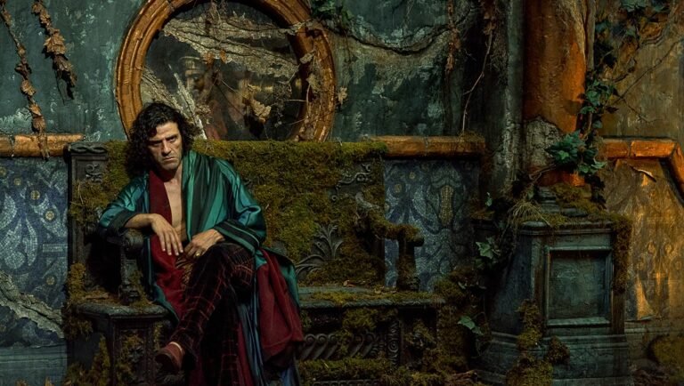 Oscar Isaac as Frankenstein in Guillermo del Toro's upcoming film, sitting on a moss-covered throne.