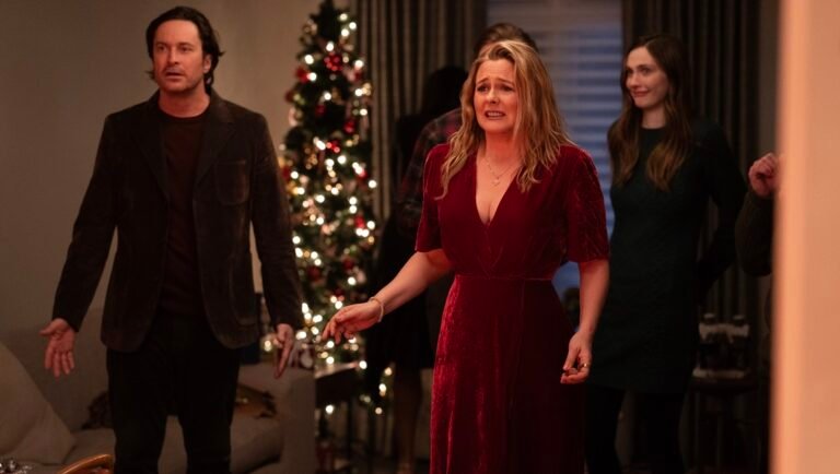 A Merry Little Ex-Mas movie scene. Alicia Silverstone in a red dress at a Christmas party.
