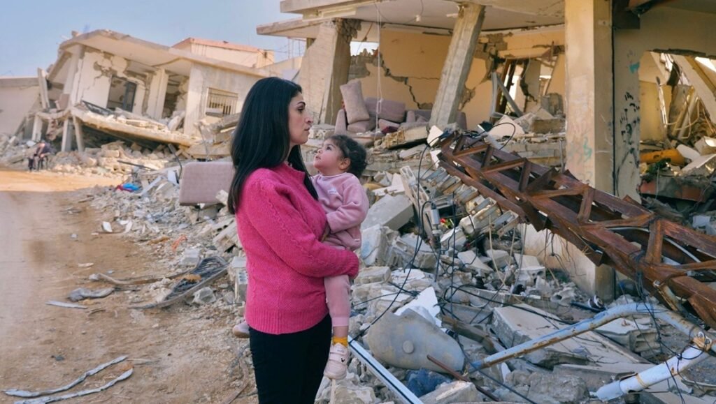 Tales of the Wounded Land film image: Mother and child amidst earthquake rubble. Tallinn Black Nights Film Festival 2025.