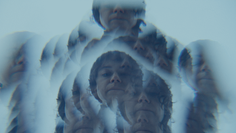 Keeper movie still. Osgood Perkins film review image. Multiple exposures of a face.