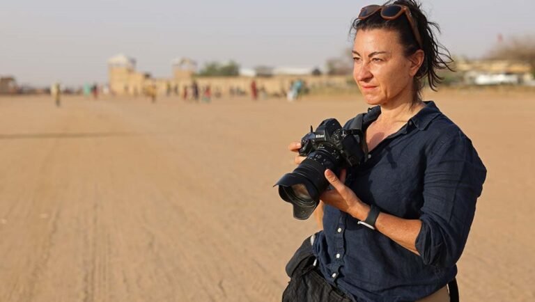 Lynsey Addario with camera.