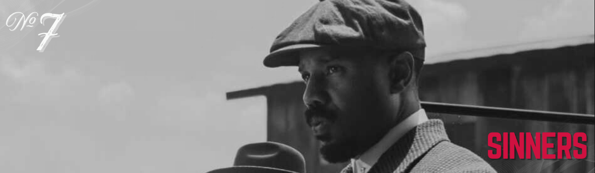 Black and white film still featuring a man in a tweed suit and cap, with the word "SINNERS" in red.