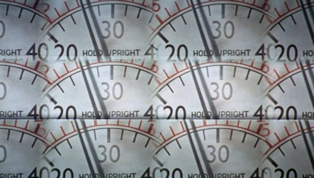 Abstract background of overlapping gauge faces with numbers, needles, and measurement markings. Industrial measurement instruments.