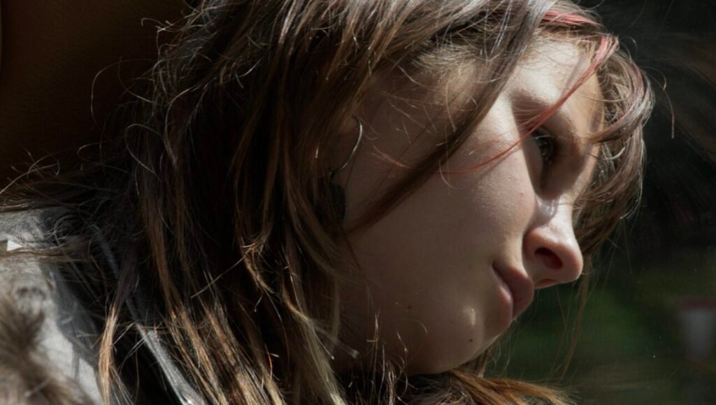 IFFR 2026: Close-up of a young person's face, reflecting on films like 'First Light' and 'The Misconceived'.