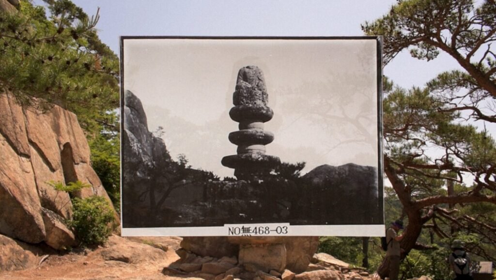 Dao film review image: Black and white photo of ancient Korean temple pagoda in Cinéma du Réel '26, nature background.
