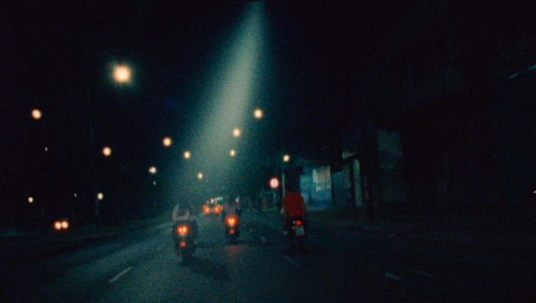 New Directors/New Films 2026 — Dispatch 1: Leviticus, Kika, Strange River Night scene from 'Leviticus' film, part of New Directors/New Films 2026, showing motorbikes on a dark street with streetlights.
