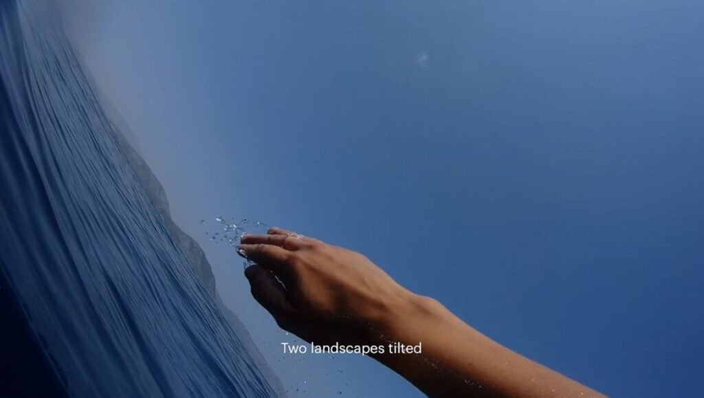 Katarakt film still from the 2026 Images Festival shows a hand with water droplets against a blue sky and rippled surface.
