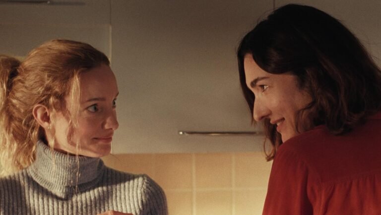 Two women in a scene from Chloé Robichaud's film, showcasing their joint venture and relationship.