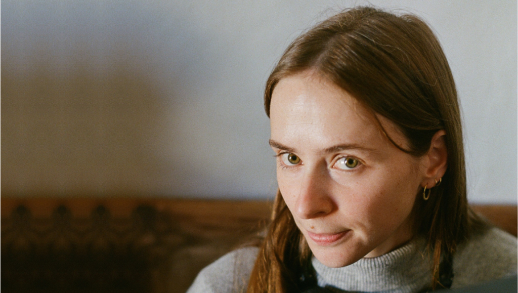 To Transform and Play Pretend: A Conversation with Lucía Aleñar Iglesias on Forastera Lucia Alenar Iglesias, director of Forastera, gazes at the camera with a slight smile.