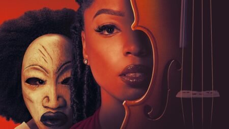 Close-up of a woman with braided hair next to a wooden mask and the body of a violin against a red background.