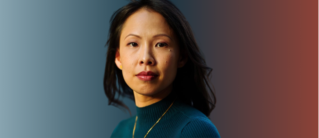 Poh Si Teng looks directly at the camera against a background transitioning from soft blue to warm red.