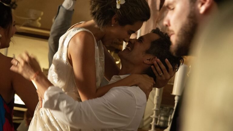 Esmeralda Pimentel and Gael García Bernal laugh while embracing closely at a celebratory event.