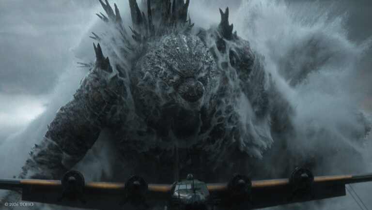 Godzilla emerging from churning ocean waves behind a military plane, dorsal spikes raised, under a stormy sky.